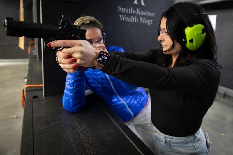 Ballistic team instructing another team member