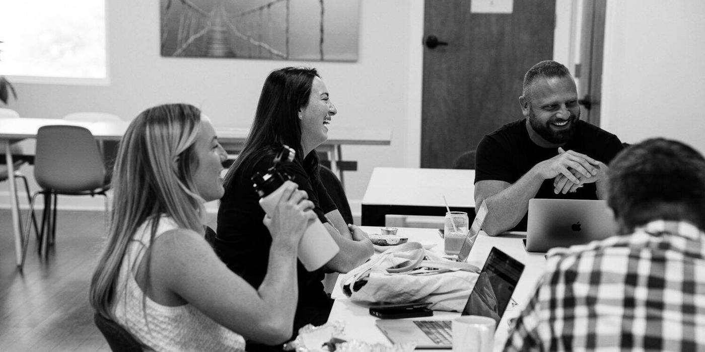 Ballistic team members reviewing a storefront build together in the office