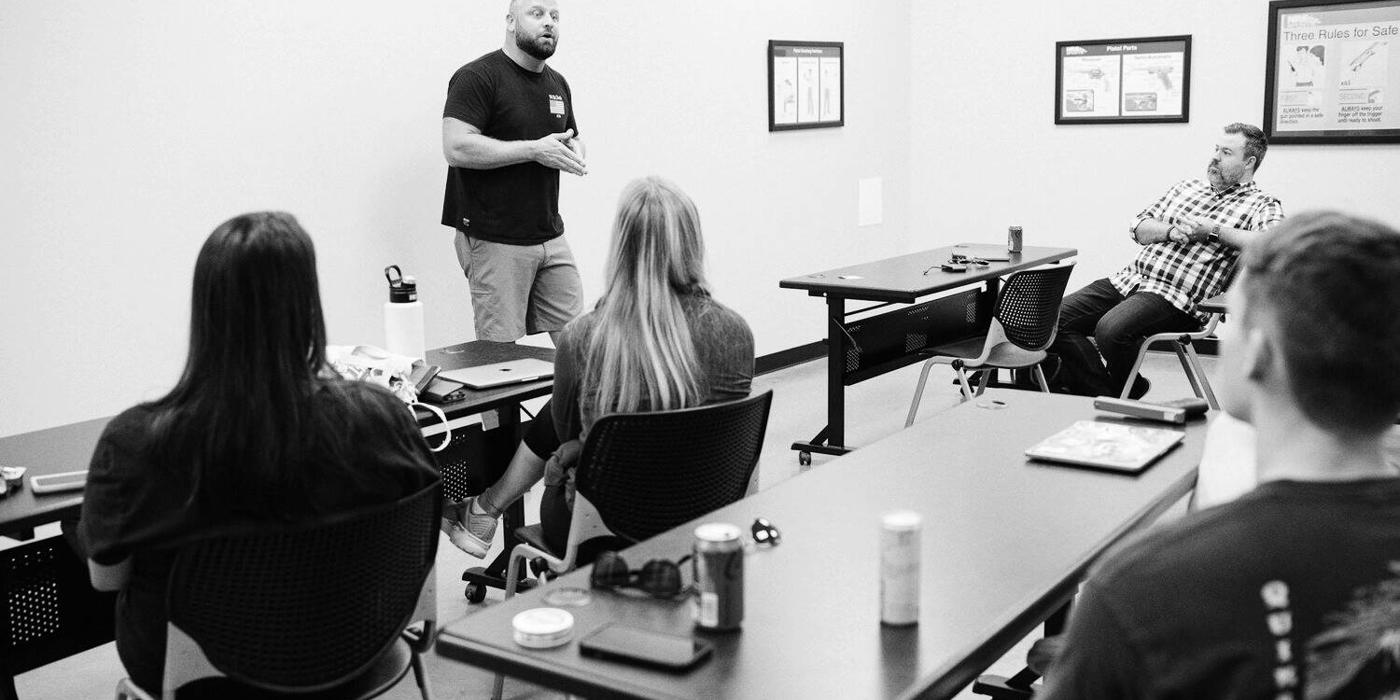 Ballistic team meeting around a table to plan a campaign