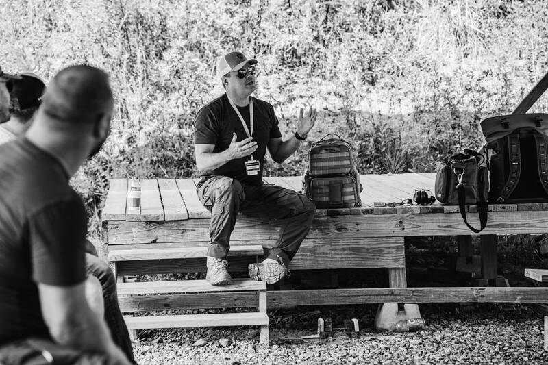 Instructor leading a range briefing for the Ballistic team